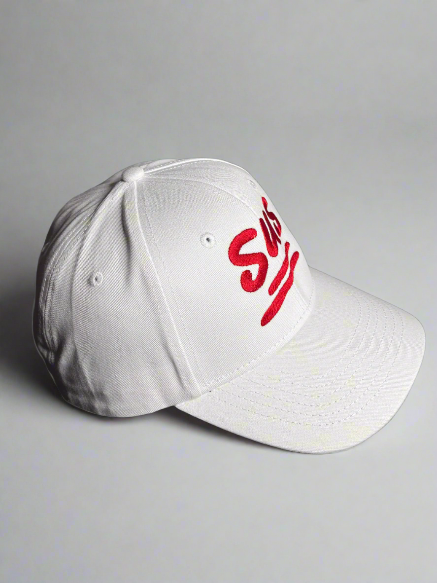 Side view of white cap showcasing the red "SUS" embroidery