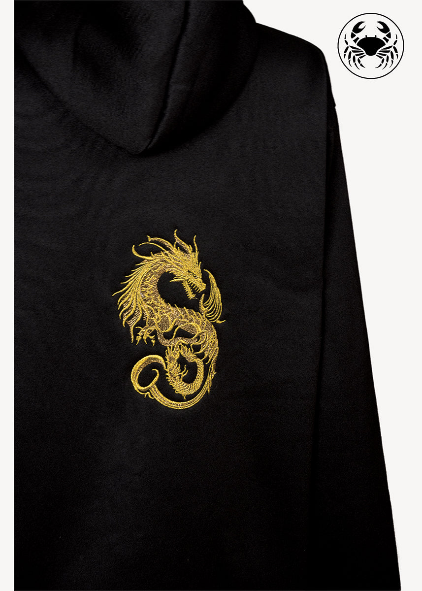 Angled view of Black hoodie featuring gold dragon embroidery on the back, unisex streetwear fashion