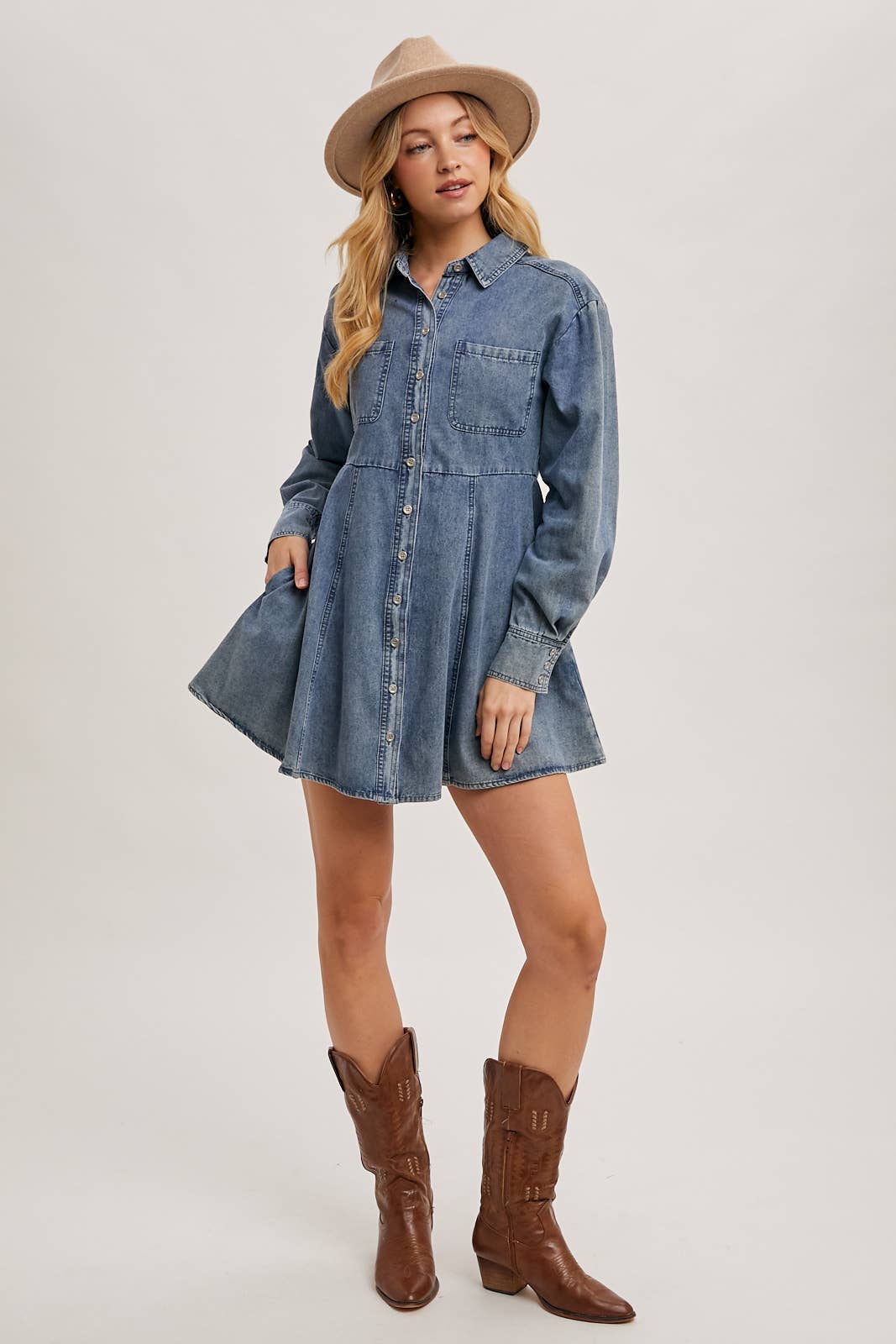front view of denim shirt dress with hand in pocket, casual A-line shape, long sleeves