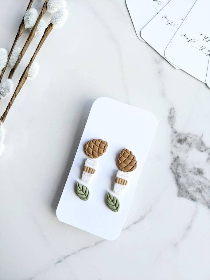 Fall Themed Stud Earring Trio Pack, featuring three pairs of handmade polymer clay studs in pinecone, coffee cup, and green leaf shapes