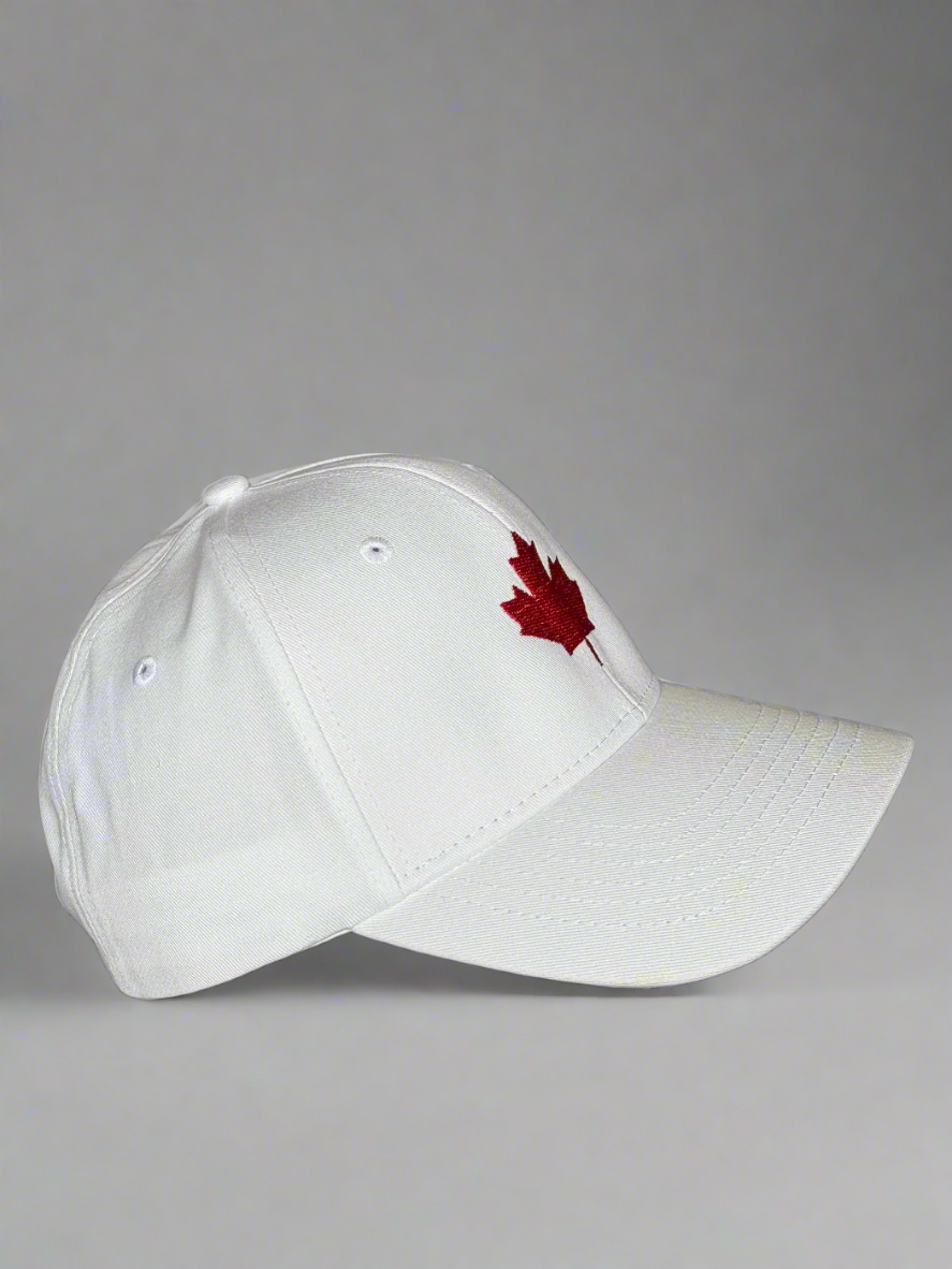 Side angle of white cap showing red maple leaf embroidery on front