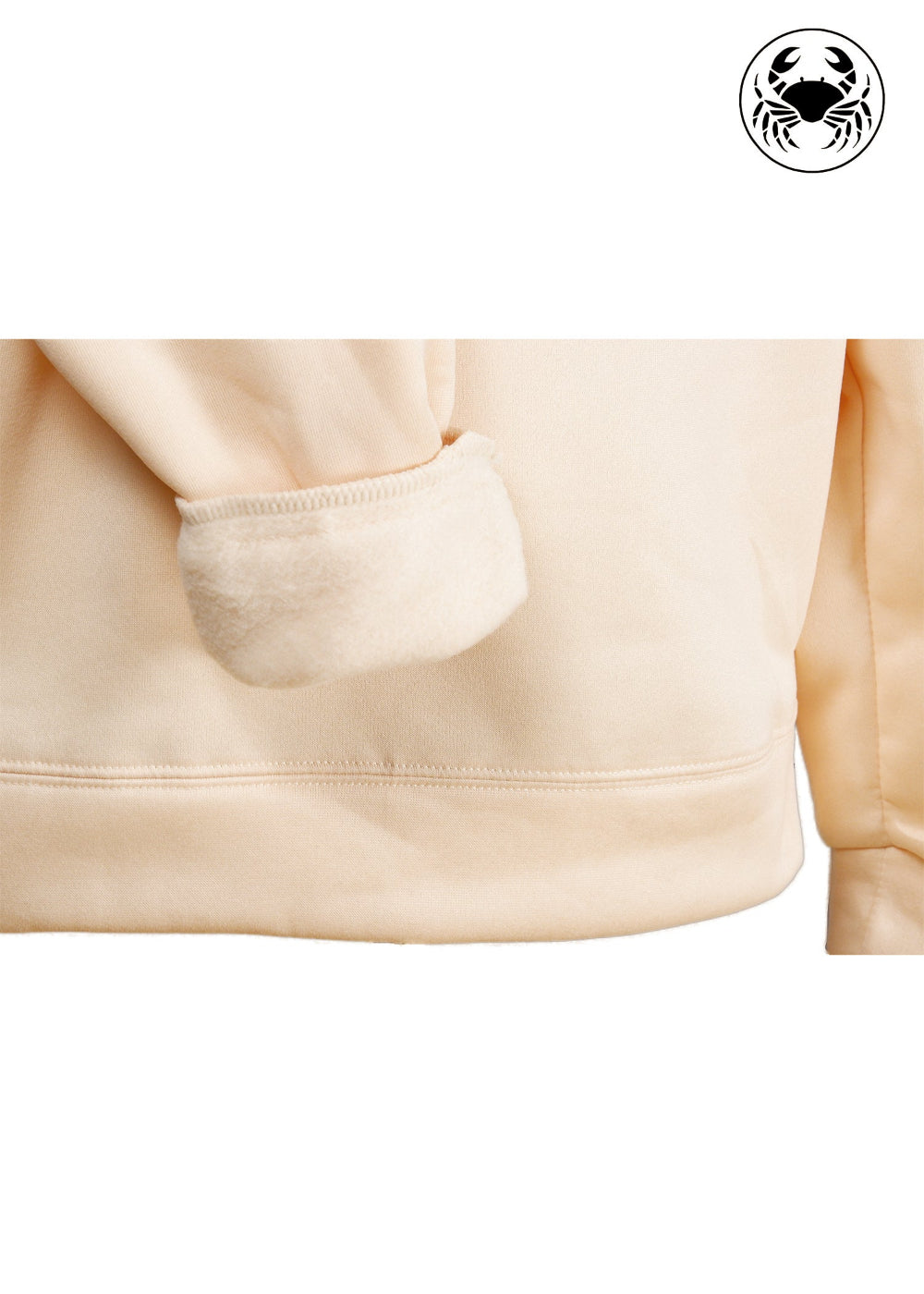closeup view of fleece fabric of Unisex beige hoodie with a front kangaroo pocket, drawstring hood, and an embroidered chest design featuring a Cat Caught in a Moment with Butterfly