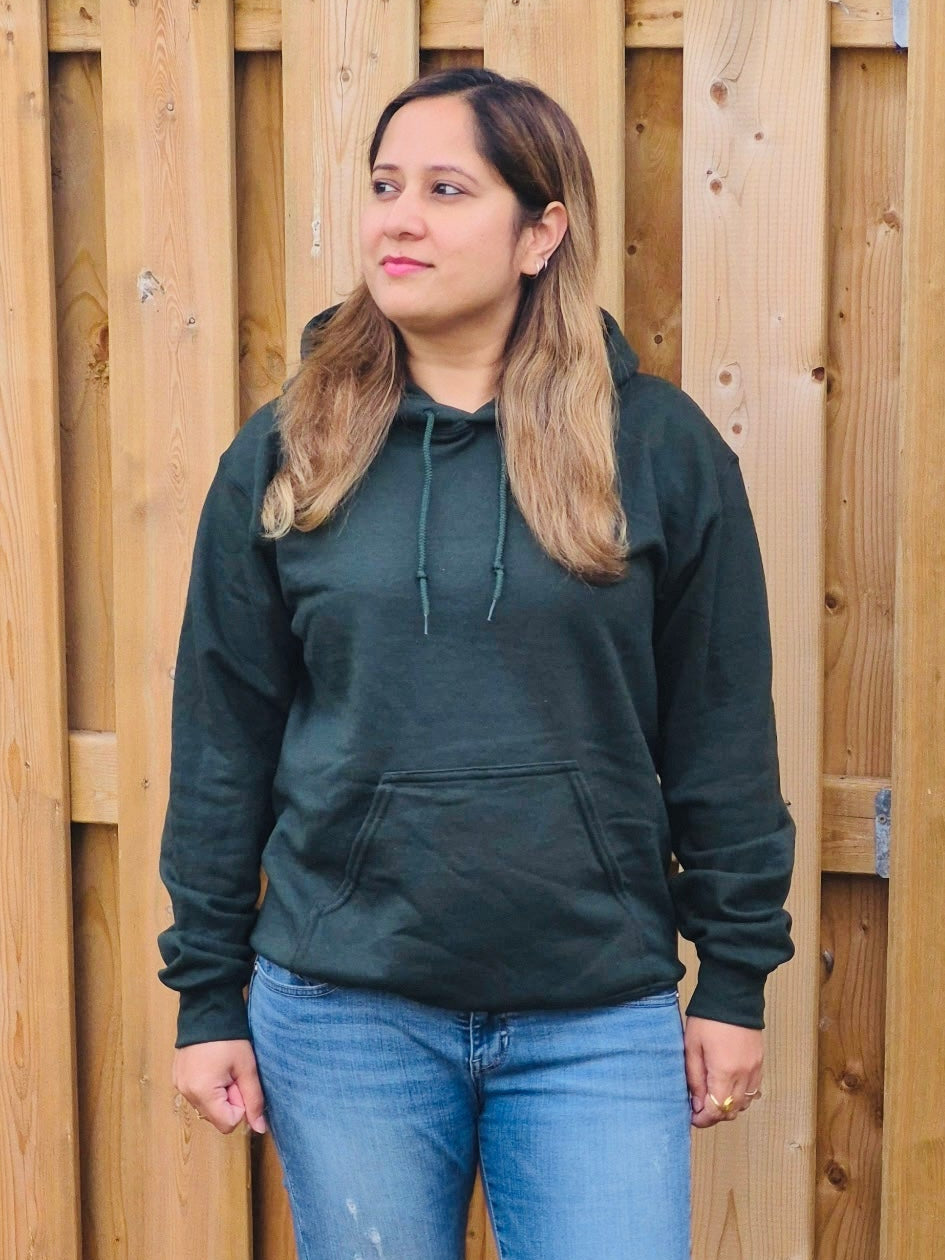 front view of Female model wearing unisex forest green hoodie with drawstring hood and front pocket