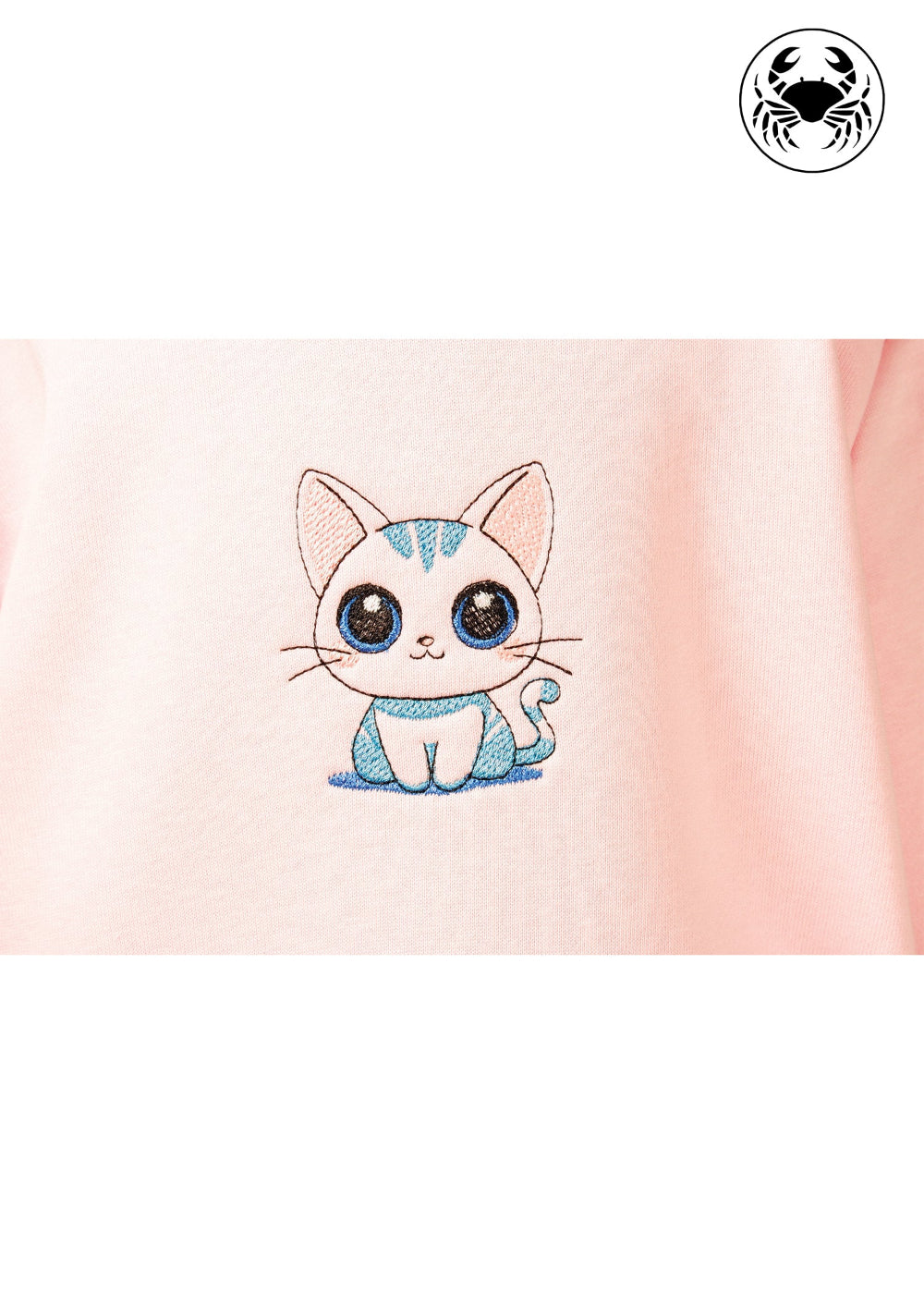 Close-up view of embroidered cute kitty design on light pink kids hoodie, Canadian apparel