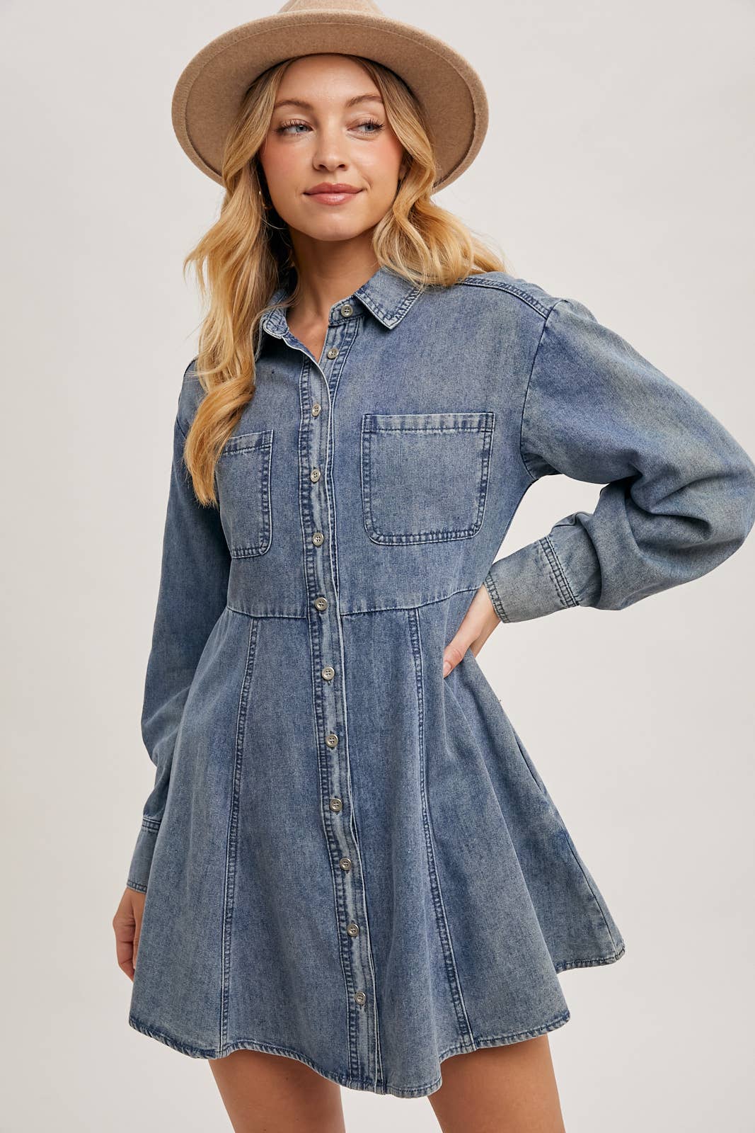 Denim shirt dress shown front-on, showcasing button details and fit