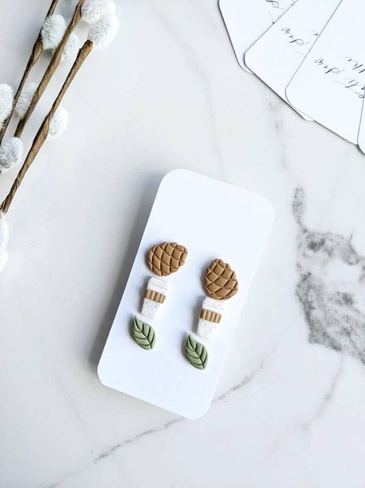 Fall Themed Stud Earring Trio Pack, featuring three pairs of handmade polymer clay studs in pinecone, coffee cup, and green leaf shapes