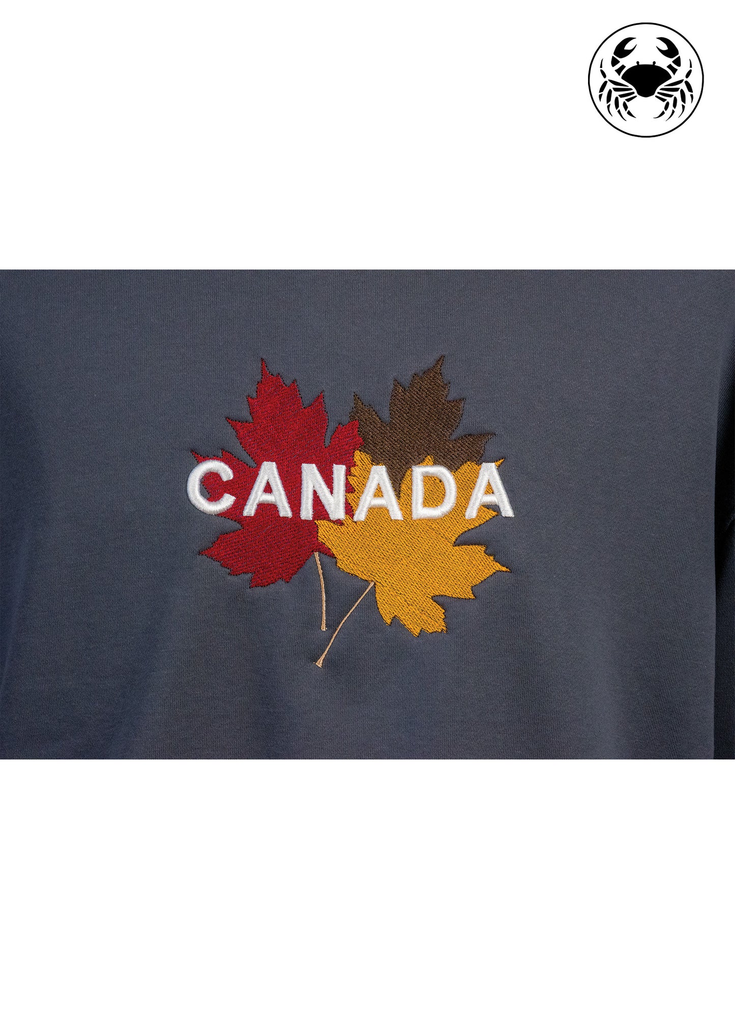Closeup view of 3D puff "CANADA"  Embroidery accented by fall maple leaf on grey sweatshirt