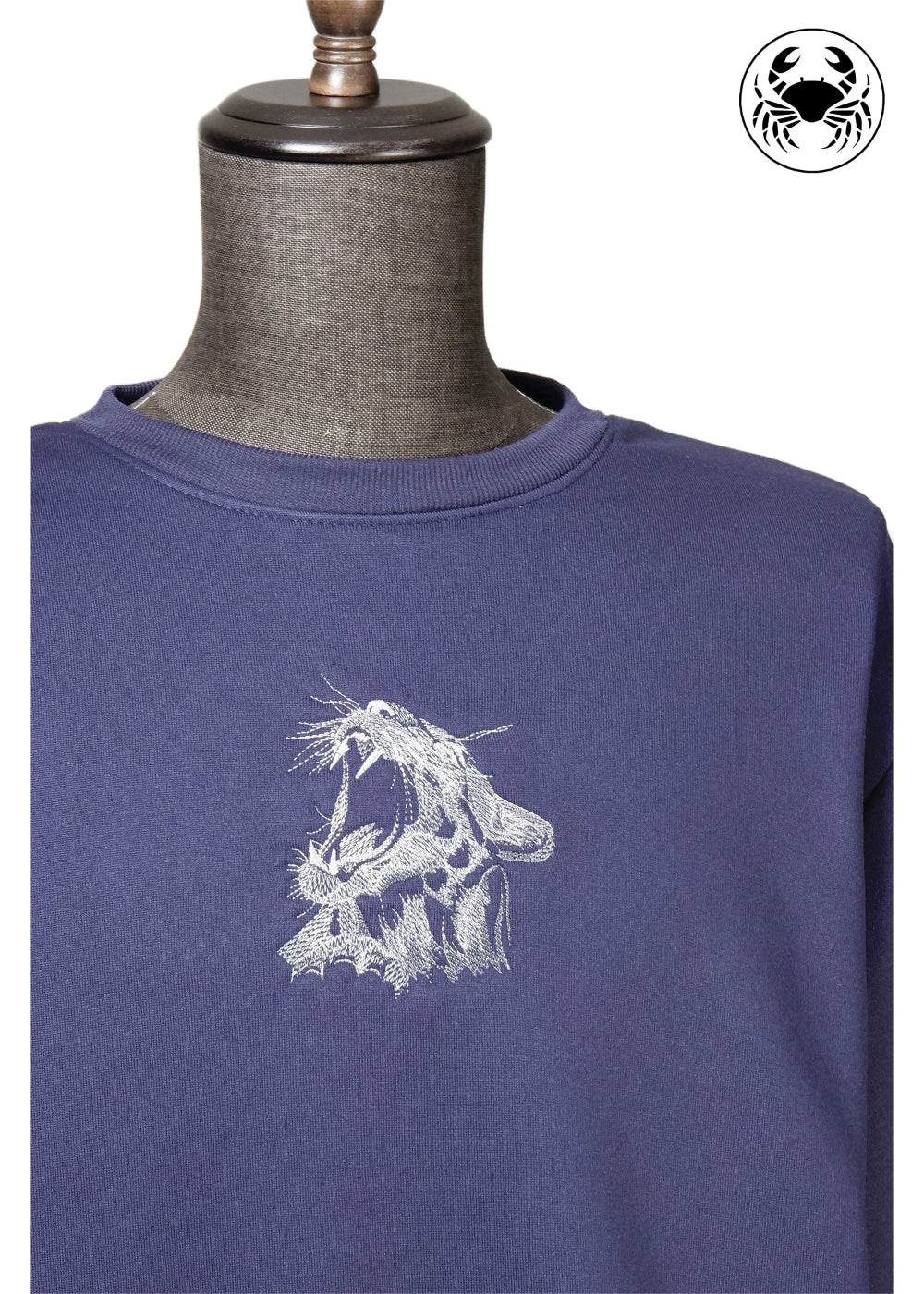 Dark blue unisex sweatshirt with roaring cat design on the chest, featuring a crew neckline and ribbed cuffs and hem