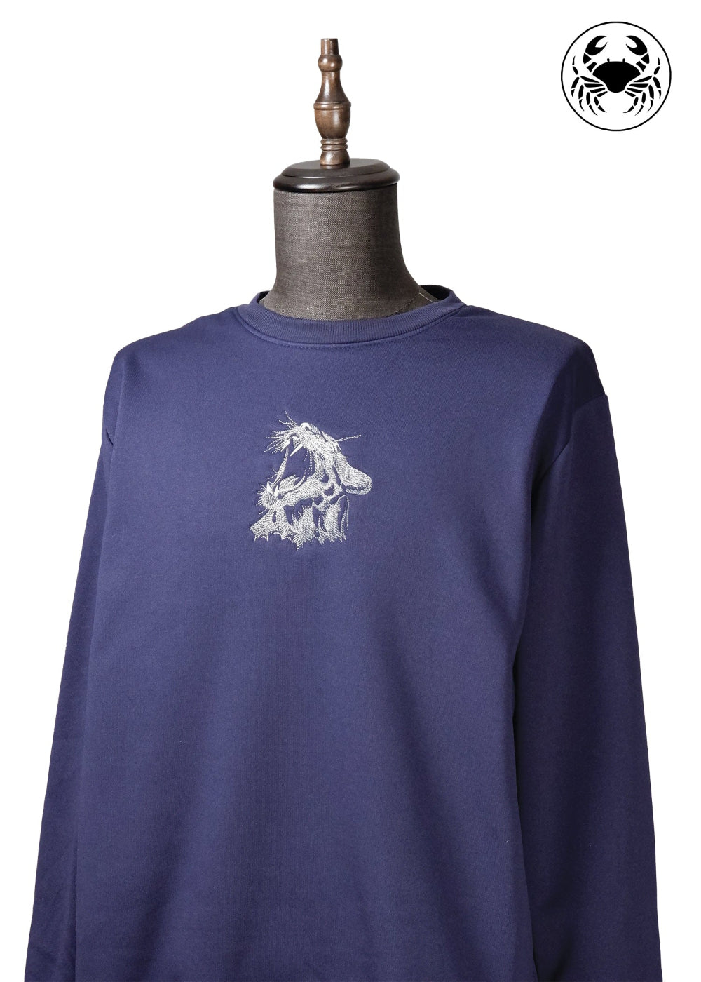 Dark blue unisex sweatshirt with roaring cat design on the chest, featuring a crew neckline and ribbed cuffs and hem