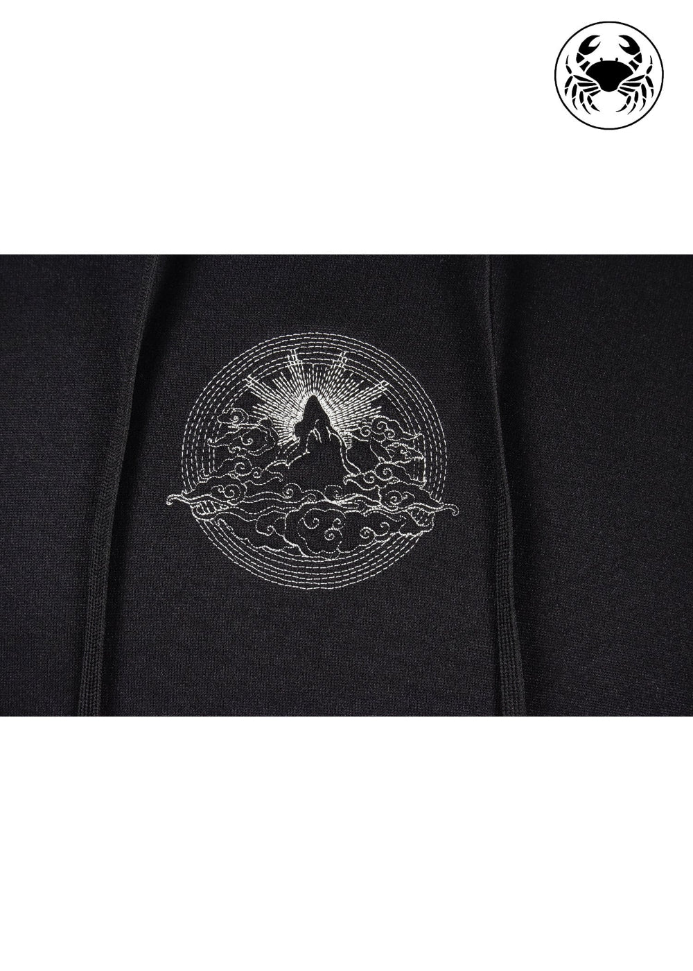 Close up view of embroidered  mountain and sun rising design 