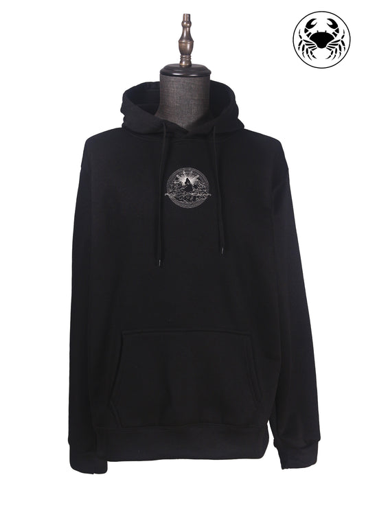 Front view of Unisex black fleece hoodie featuring a front kangaroo pocket, adjustable drawstring hood, and an embroidered  mountain and sun rising design 
