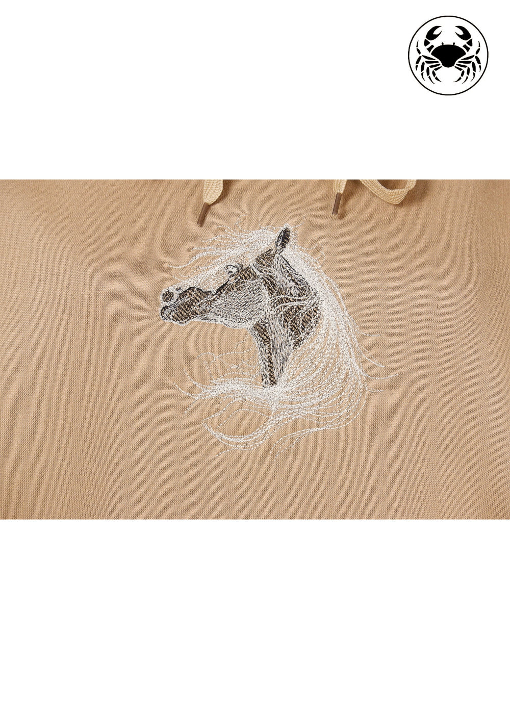Close up view of embroidered design featuring a white horse
