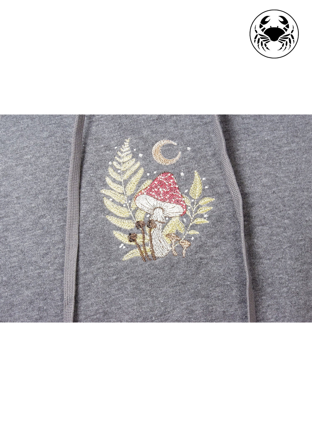 Close up view of  chest graphic featuring a mushroom, and botanical leaves