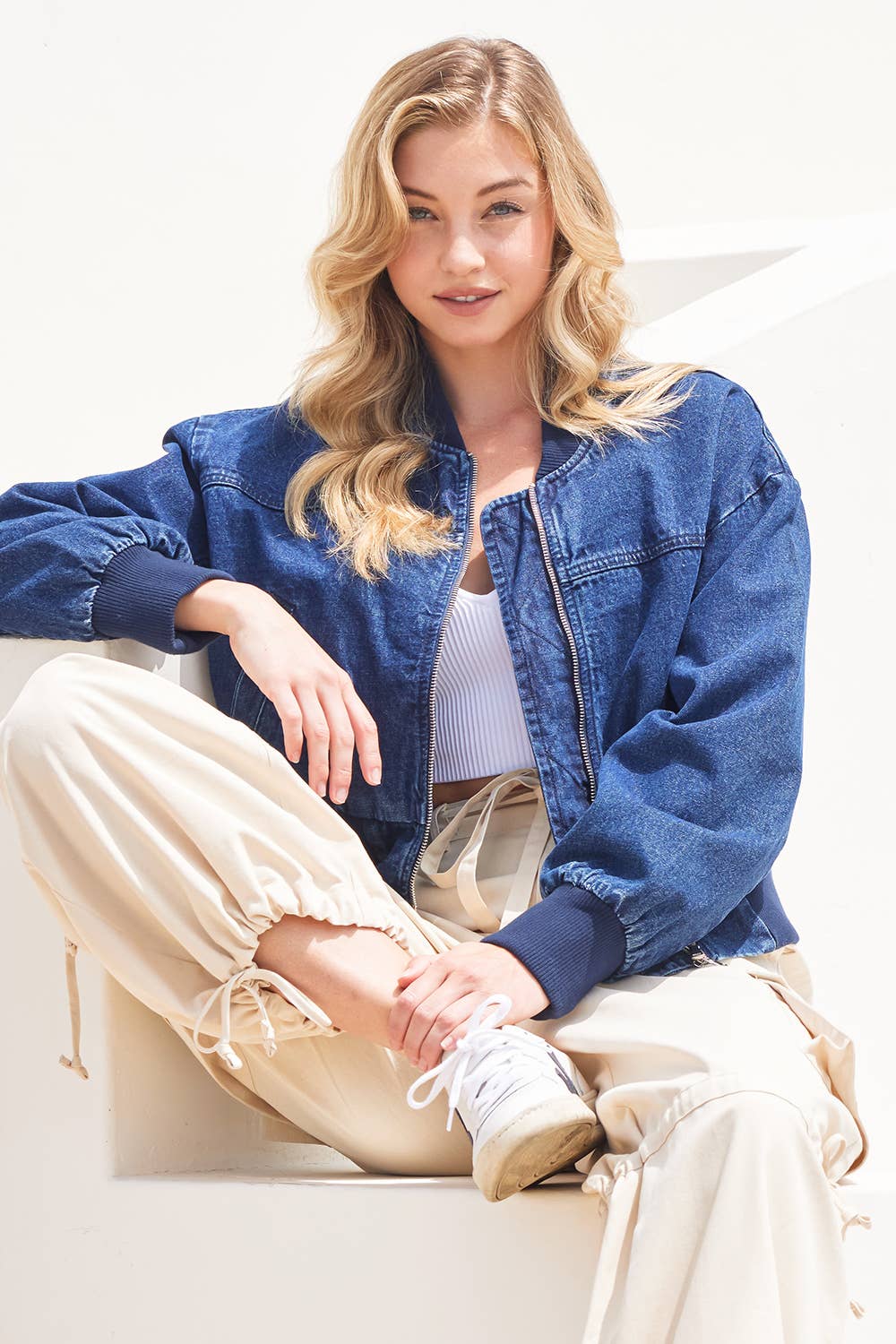 Side view of Karkata NC Boutique women's denim bomber jacket