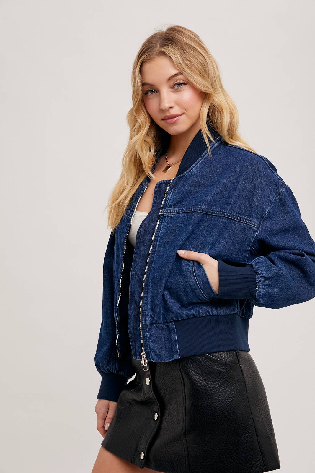 Karkata NC Boutique denim bomber jacket in motion, walking pose
