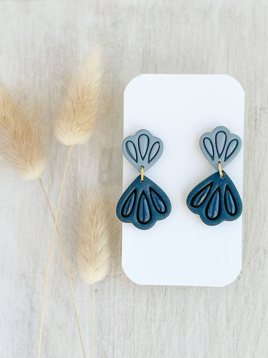 Handmade teal polymer clay drop earrings with modern cutout design, lightweight and hypoallergenic, artisan jewelry crafted in Canada.