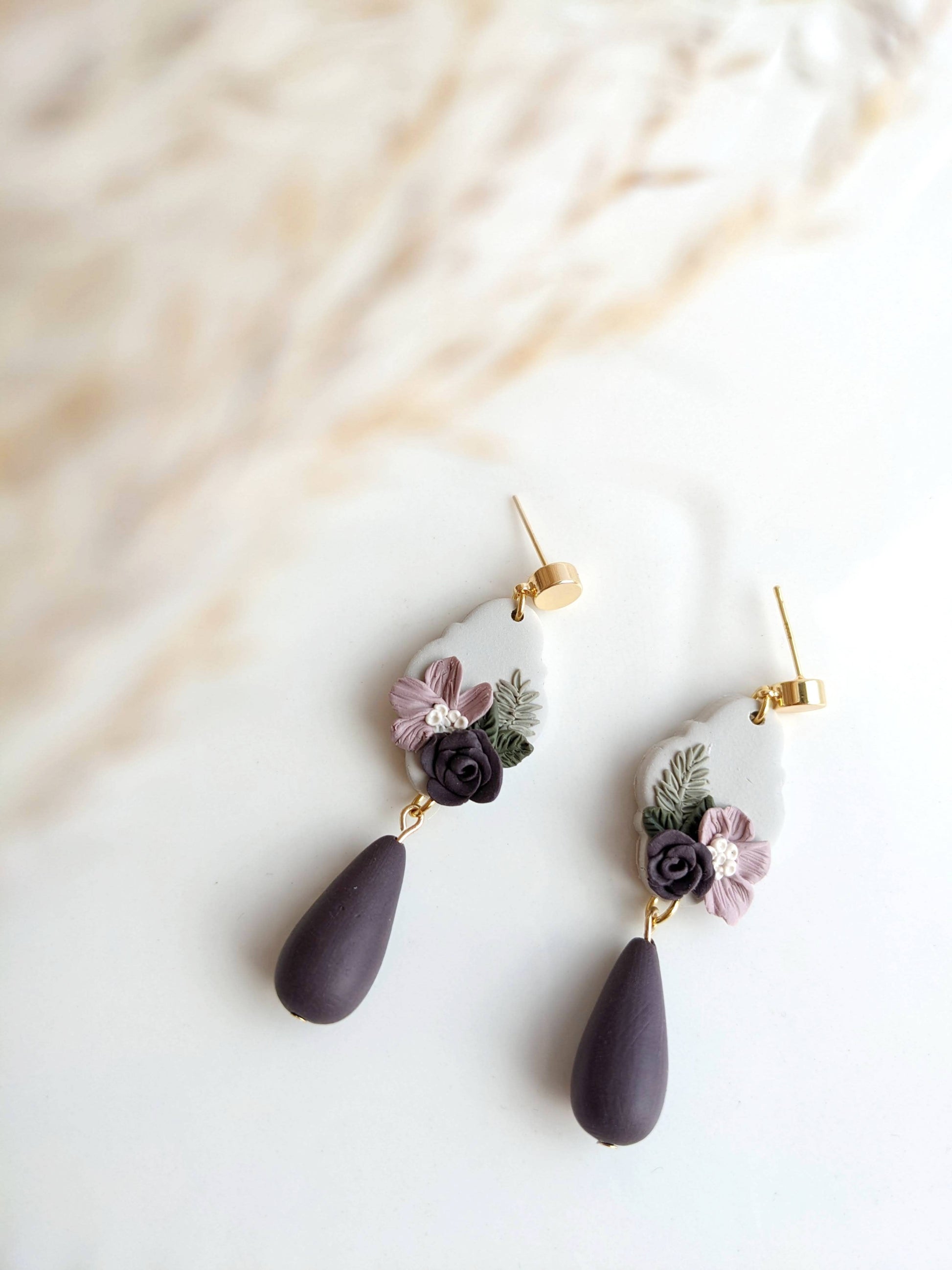 Handmade polymer clay earrings with hypoallergenic stainless steel posts, lightweight and comfortable for sensitive ears, crafted in Canada.