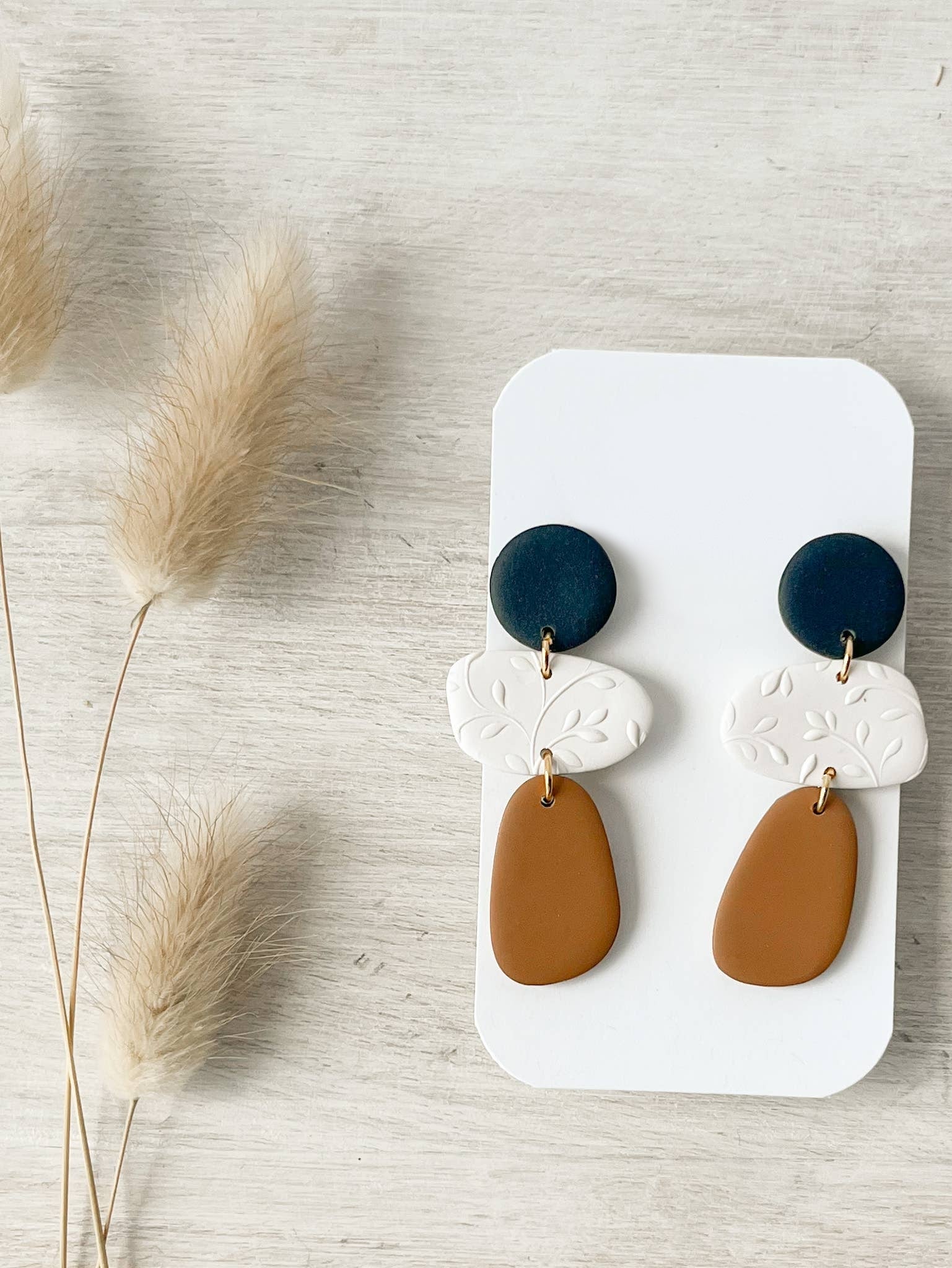 Handmade polymer clay earrings with hypoallergenic stainless steel posts, lightweight and comfortable for sensitive ears, crafted in Canada.