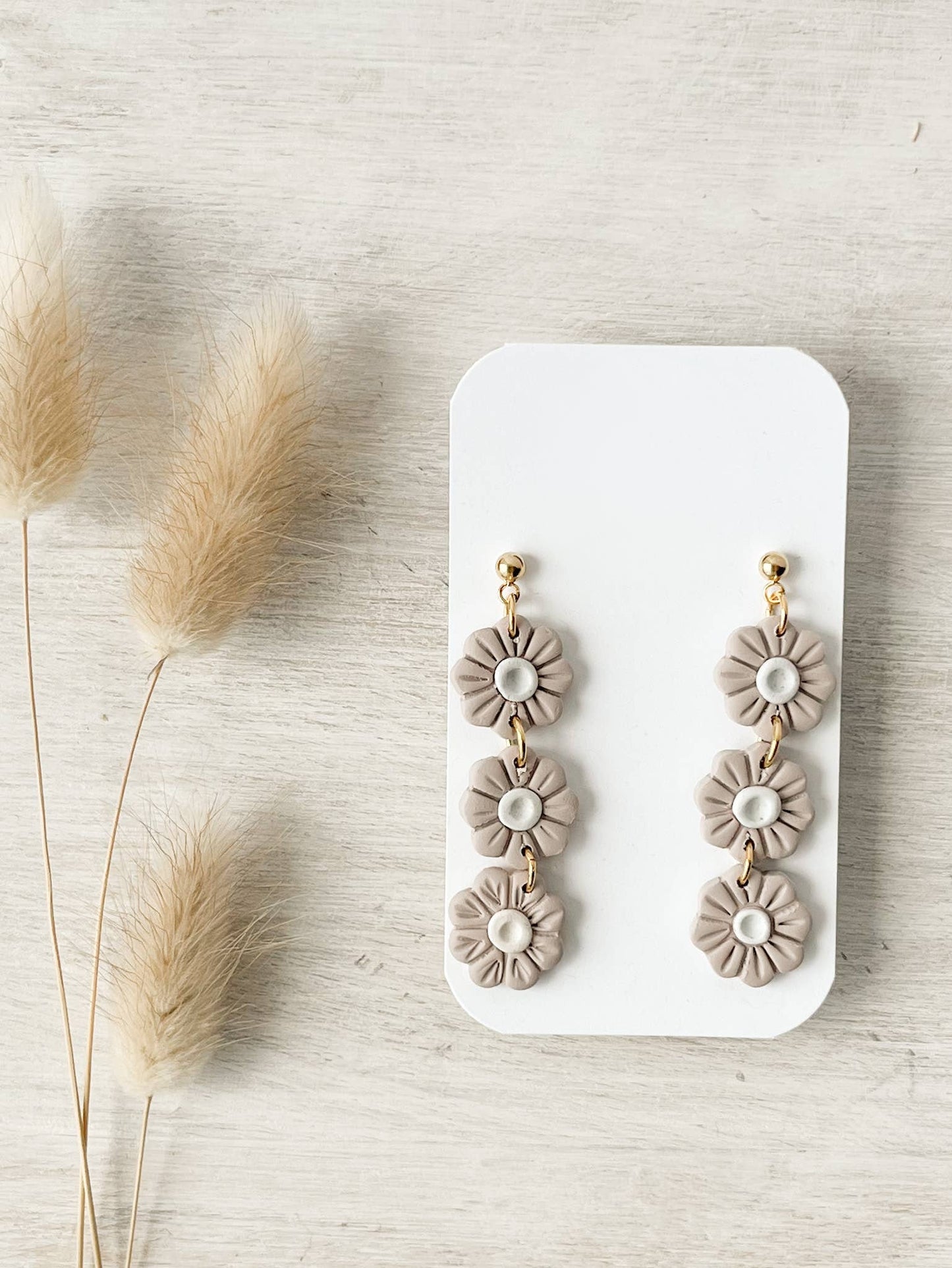 Minimalist handmade polymer clay stud earrings, hypoallergenic and lightweight for everyday wear.