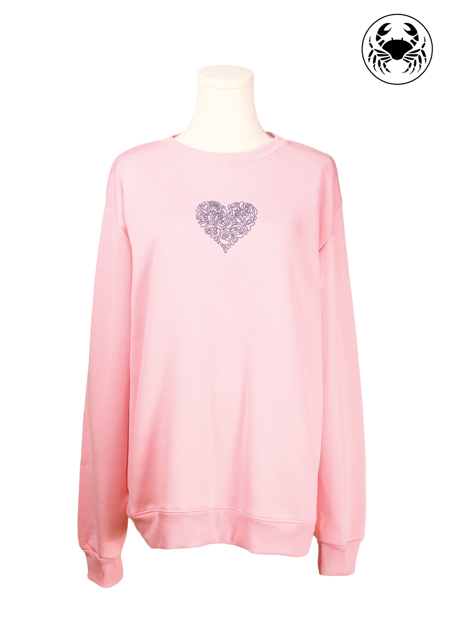 Front view of Light pink unisex crewneck sweatshirt featuring a delicate embroidered heart design on the chest, long sleeves, ribbed cuffs and hem