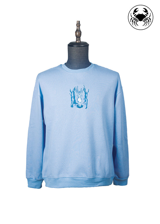 Front view of Karkata NC Boutique sky blue embroidered sweatshirt featuring deer in forest design