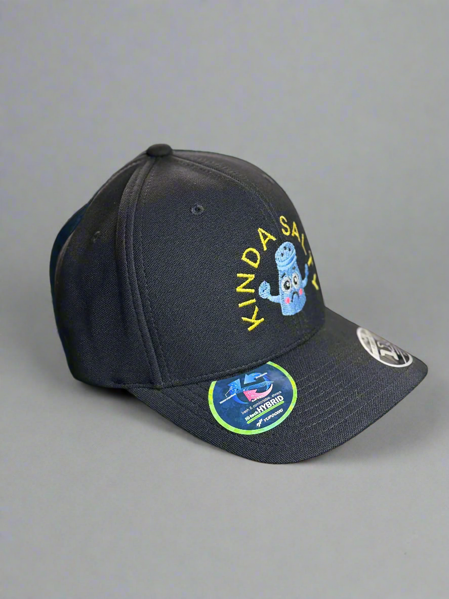 Side view of black cap with embroidered sad blue salt shaker and yellow “KINDA SALTY” text hat showing cap profile and stickers