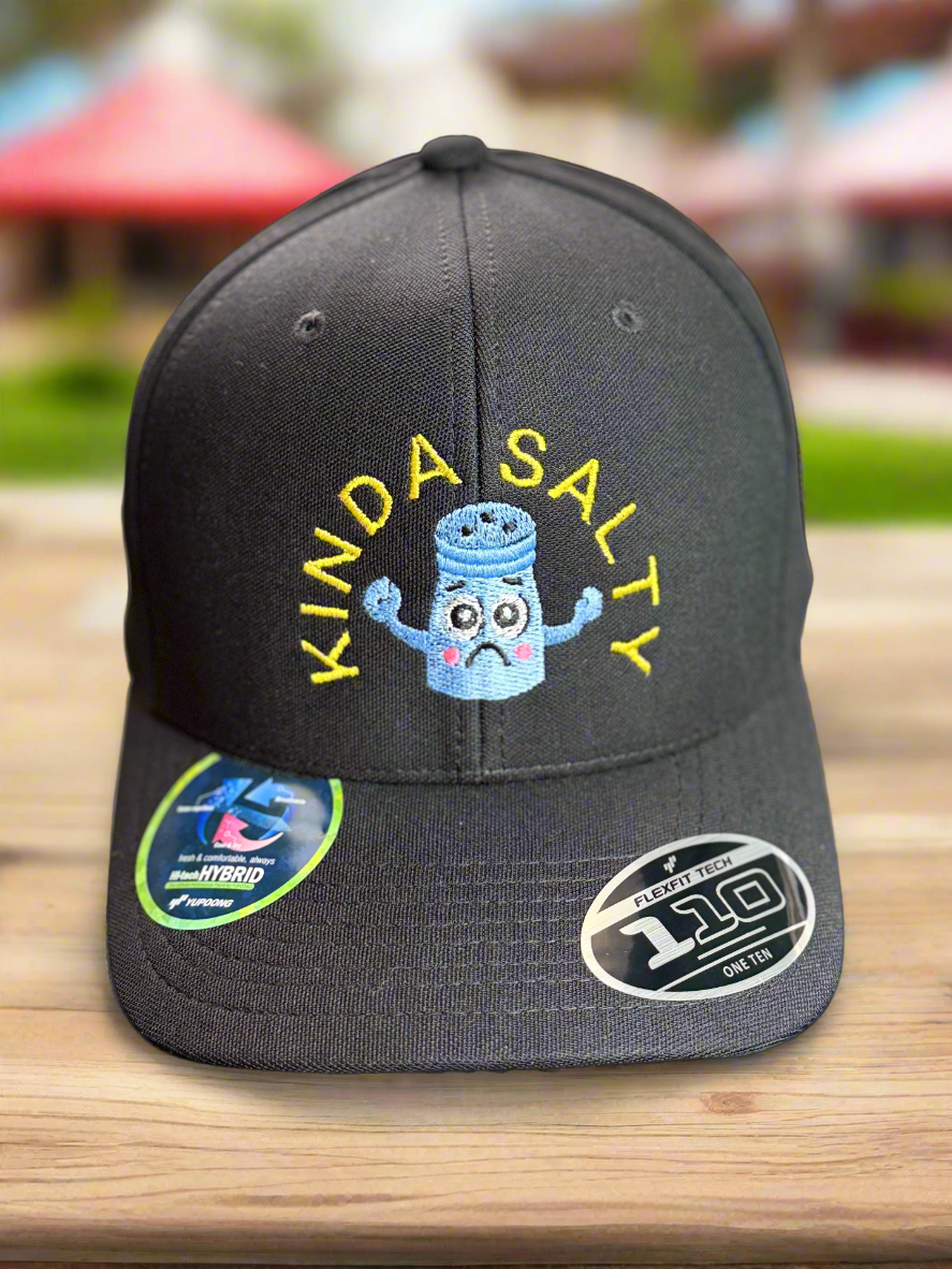 Front view of black cap with embroidered sad blue salt shaker and yellow “KINDA SALTY” text