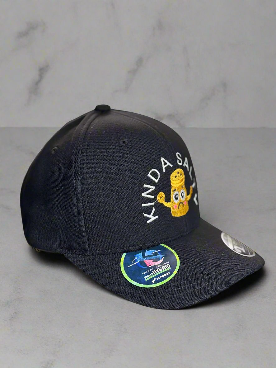 Side view of black cap with embroidered sad yellow salt shaker showing sticker details