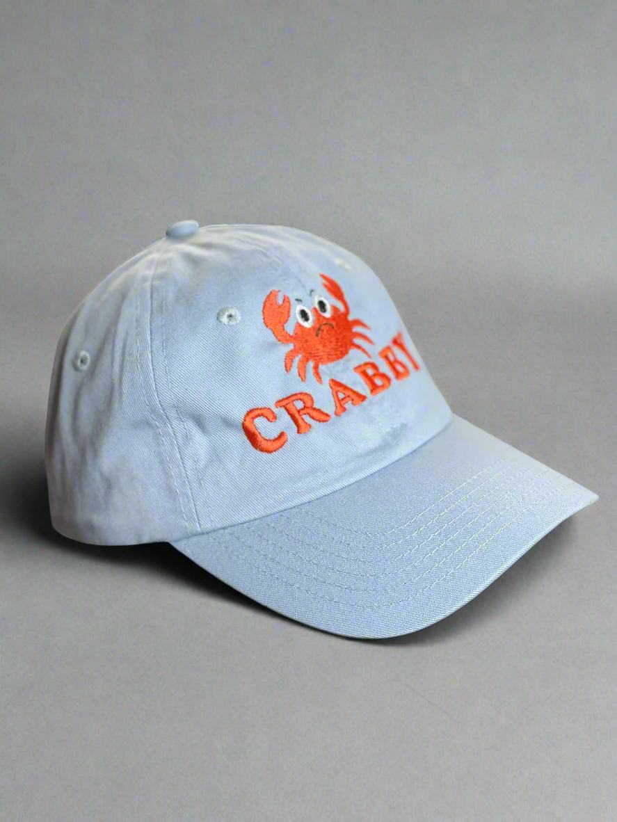 Pale blue hat with red crab and CRABBY text front embroidery