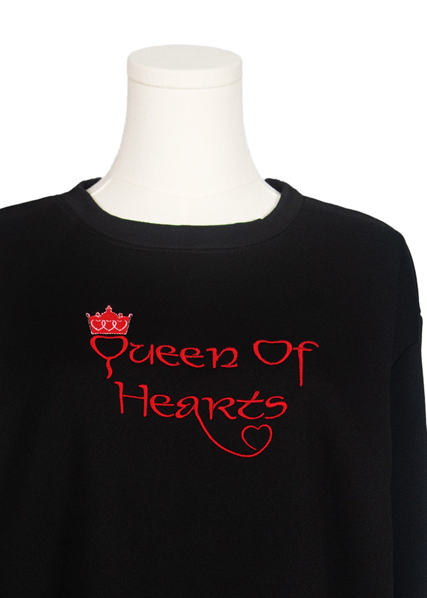 Close-up of black sweatshirt with “Queen of Hearts” embroidered design, Canadian apparel