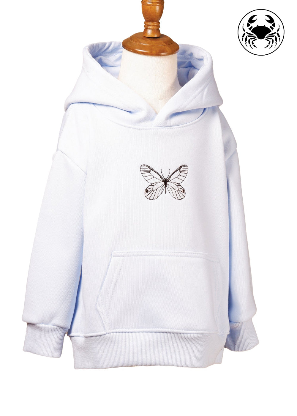 Front angled view of sky blue hoodie for kids with embroidered butterfly design, Canadian apparel